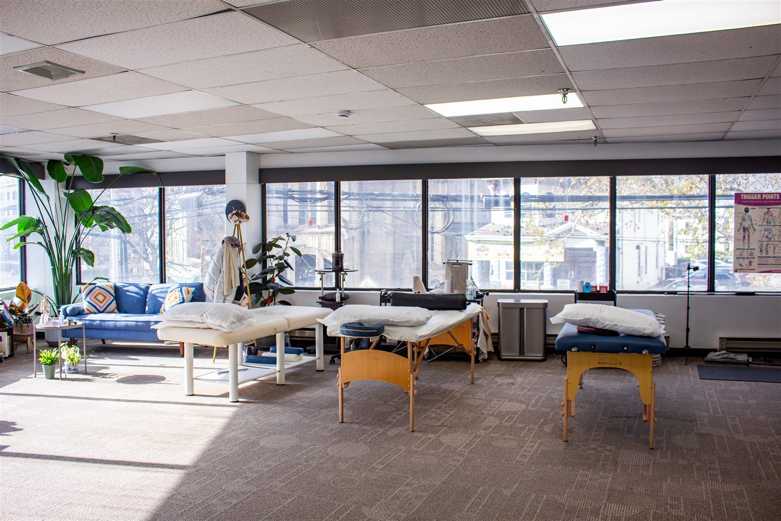 Jersey City sunlit treatment floor with multiple tables