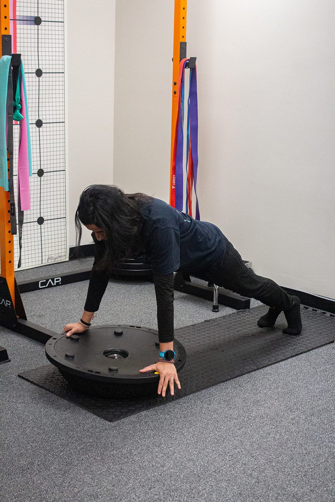 Dr. Foram Patel demonstrating a push-up exercise, second angle